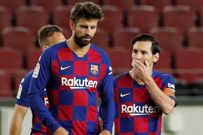 Gerard Pique y Lionel Messi